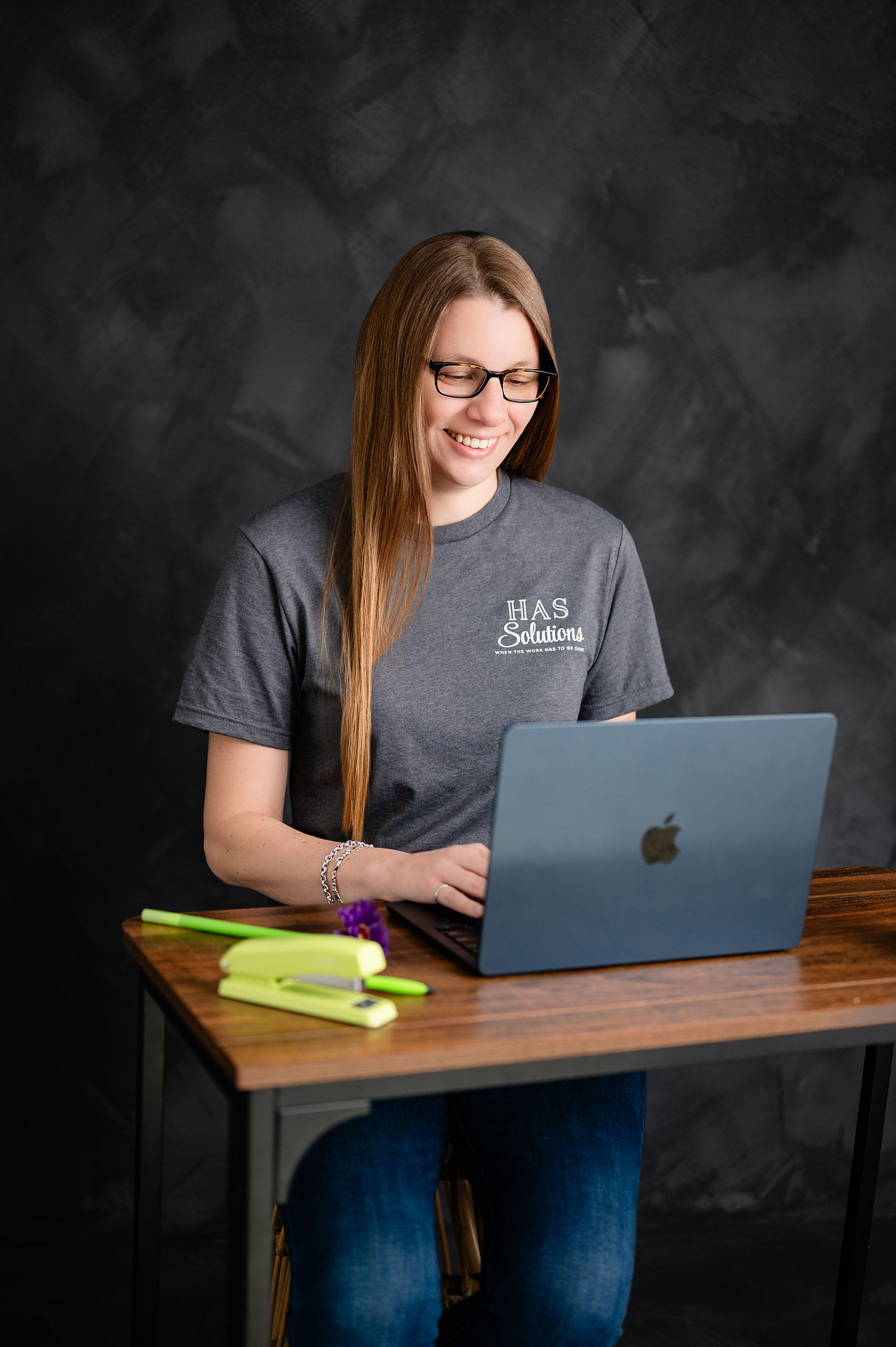 Heather working on computer for HAS Solutions Heather working on computer for HAS Solutions
